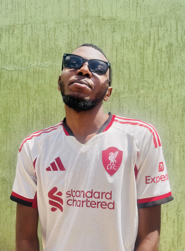 A man in sunglasses smiles