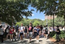 Students walk across a college campus