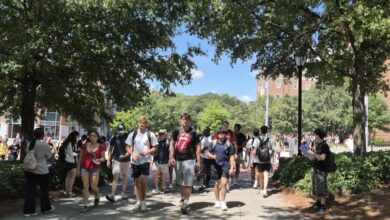 Students walk across a college campus