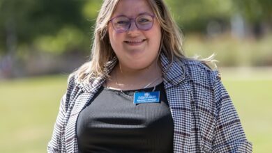 Marissa Chastain, vice president of operations for the Athens Area Chamber of Commerce, poses for a picture outside Grady College of Journalism and Mass Communication.