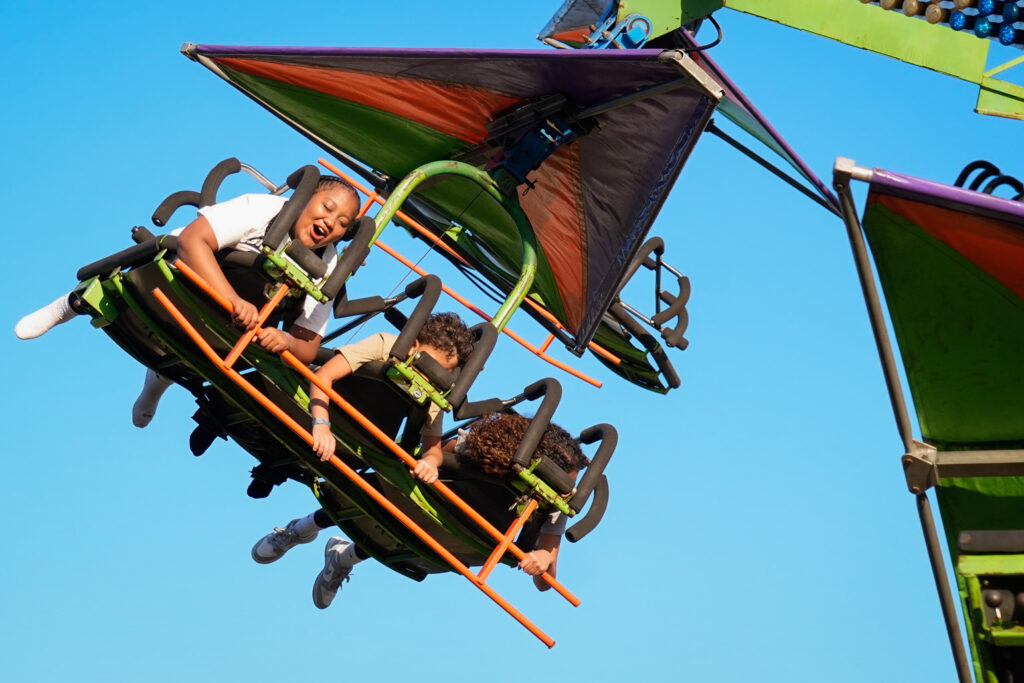 Children on a fair ride in the air