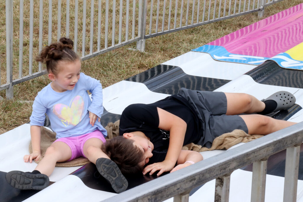 Children move down a slide