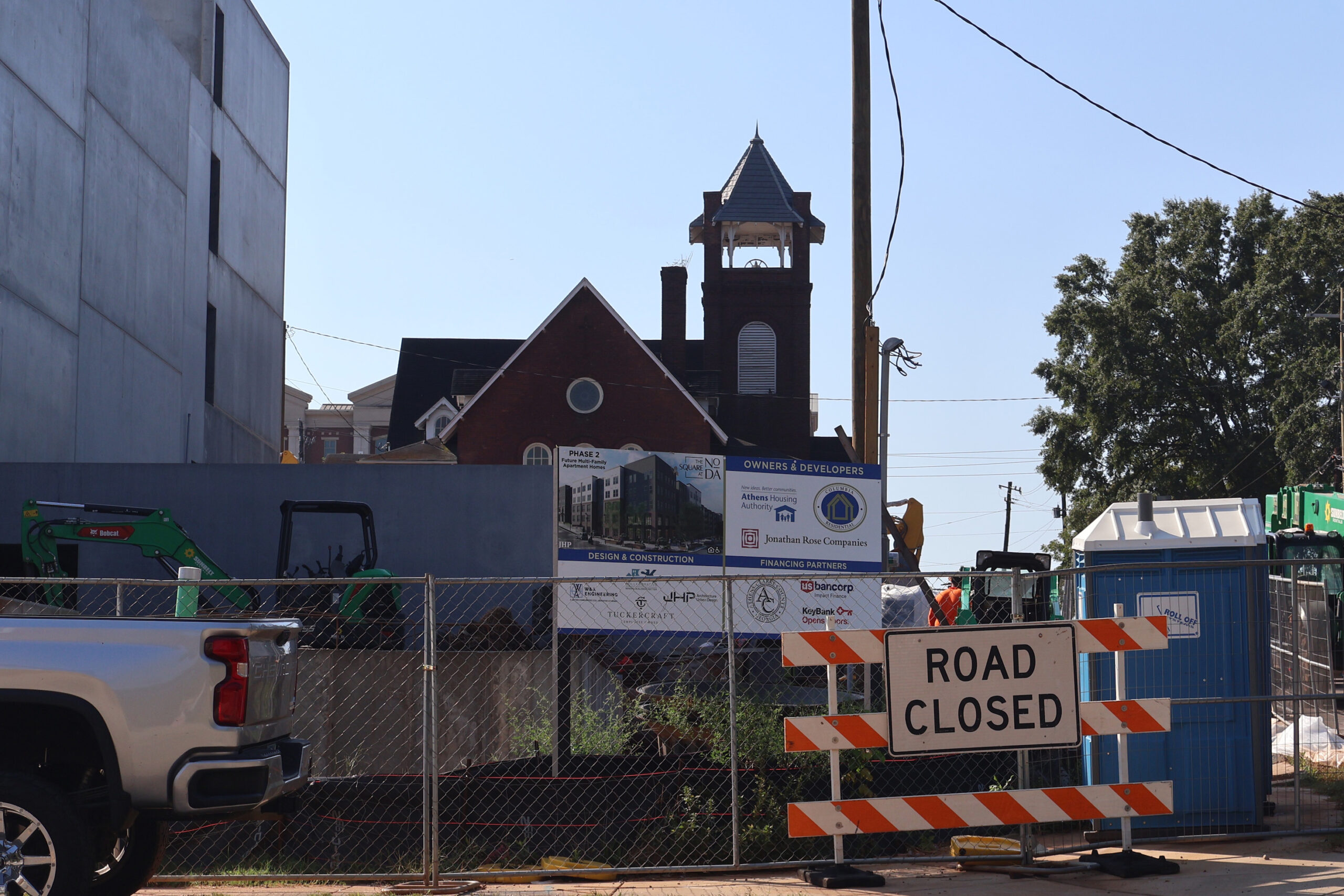 A road closed sign sits at the entrance to the North Downtown Athens redevelopment construction site.